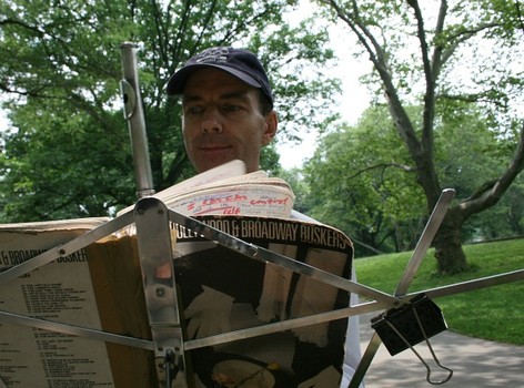 Martin Jennings moved his music stand and flute along as the line moved. When the line dwindled to only a few people, he decided to get a pair of tickets, as well.